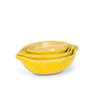 Set of four stacked yellow lemon-shaped nesting bowls