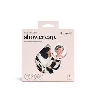 Leopard print Eco-Friendly Kitsch Shower Cap is visible through a teardrop-shaped window in light pink packaging