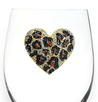 Rhinestone-encrusted leopard print heart decal on the body of a clear wine glass