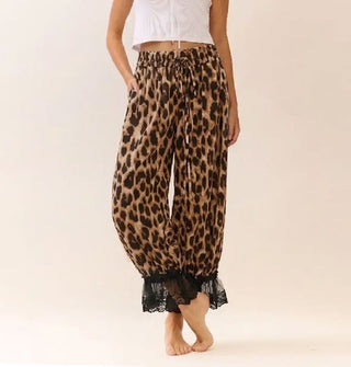 Model wears leopard print pantaloons with black lace trim and an elastic tie waist