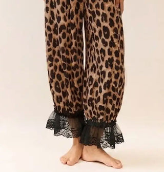 Model wears leopard print pantaloons with black lace trim
