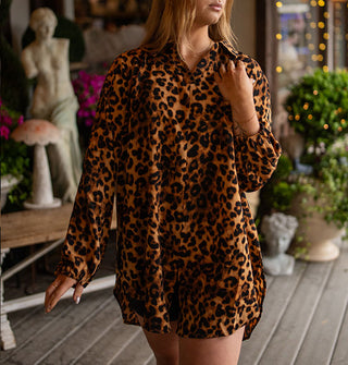 Model wears an oversized-fit leopard print blouse with collar