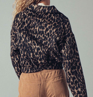 Model wears a zip-front collared leopard print jacket with an elastic waist