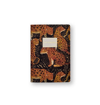Notebook cover illustrated with leopards surrounded by ferns and lightning bolts says, "Notebook" in gold foil lettering inside a central white title block