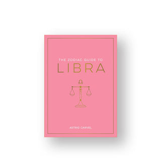 Pink cover of The Zodiac Guide to Libra by Astrid Carvel features white and gold lettering and a central illustration of a scale