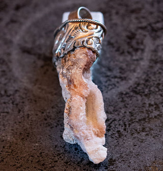 Light orca agate chunk pendant set in engraved silver top with round bail