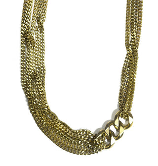 Gold-toned necklace with multiple strands of narrow curb chain on either side connected by three large curb links off-center to the right
