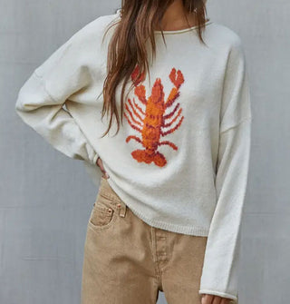 Model wears a white sweater with red lobster graphic