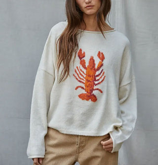 Model wears a white sweater with red lobster graphic