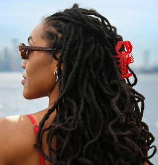 Model wears a red lobster hair claw clip