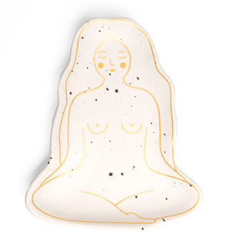 Flecked white ceramic incense dish decorated with metallic gold outline illustration of a naked woman seated in lotus pose