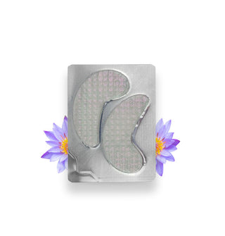 Foil pack of two under-eye masks flanked by two purple lotus flowers