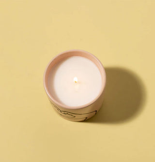 Candle jar with one lit wick shown from above