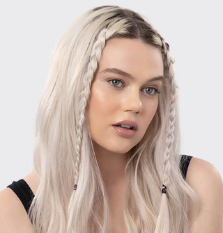 Model wears two thin braids in the front of a sleek hairstyle, secured by black elastics