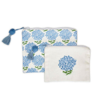 Set of two blue and white hydrangea-themed print zippered pouches, each with a blue pom-and-tassel pull tab