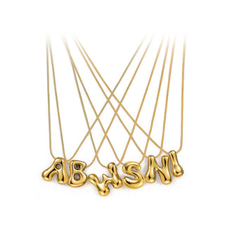 Grouping of gold necklaces with cable chains and bubble letter pendants