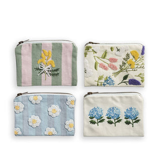 Grouping of four rectangular cotton zippered pouches, all with a unique floral design, some with beaded details