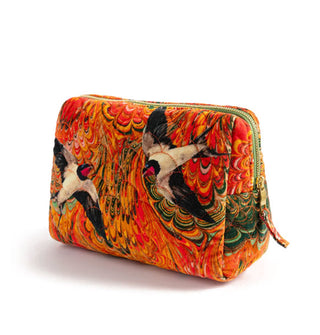 Orange marbled velvet bag with flying swallows and top zipper with pull tab