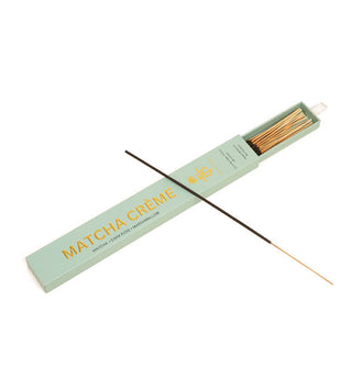 Light green slide box of Matcha Crème incense sticks with white ribbon pull and metallic gold lettering