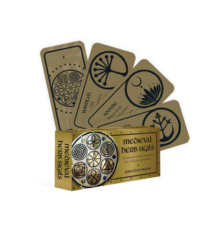 Box and sample cards from the Medieval Herb Sigils deck, with Windfall and Soothe most legibly at the center of the spread, all featuring plant symbols