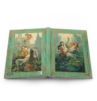 Hardcover journal laying flat open to show front and back covers which feature vintage mermaid illustrations