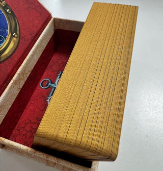 Gilded card edges of the Dame Darcy Mermaid Tarot inside their box