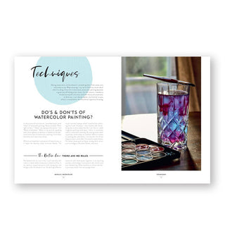 Page spread from Metallic Watercolor features a chapter titled, "Techniques" with a section on the Do's & Don'ts of Watercolor Painting alongside a photograph of purple and blue paint-muddied water in a crystal glass with a paintbrush on top