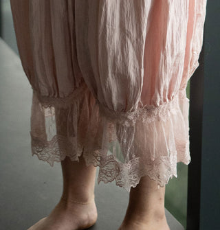 Model wears light pink pantaloons with lace trim