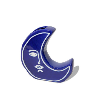 Blue crescent moon-shaped vase with white facial details
