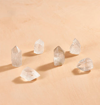 Grouping of six crystal quartz points in varying shapes and sizes