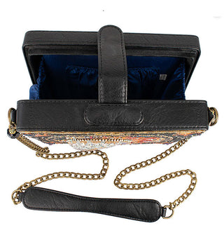 Opened black handbag with gold chain features a three-dimensional beaded outer design and a dark blue interior lining
