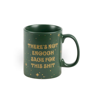 Green coffee mug says, "There's not enough sage for this shit" in decorative gold lettering surrounded by gold stars