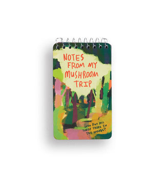 Small spiral-bound notepad features impressionistic forest scene and the words, "Notes from my mushroom trip" at the top and, "Who put all these trees in the woods?" at the bottom