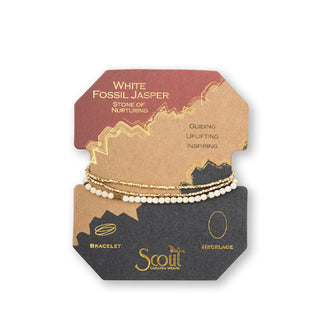 White fossil jasper and gold beaded bracelet/necklace wrapped around product card with gold foil design details