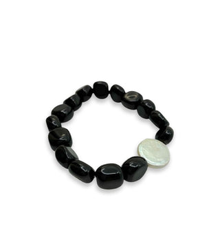 Polished obsidian gemstone bracelet with one flat white accent pearl