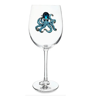 Clear wine glass with bejeweled blue rhinestone on its bowl