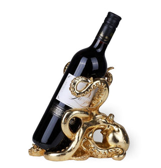 A 750ml bottle is wrapped around a gold octopus-shaped wine bottle holder 
