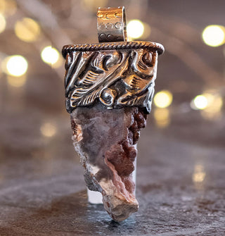 Dark orca agate chunk pendant set in engraved silver top with round bail