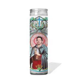 Tall glass prayer candle with label illustration depicting Pedro Pascal as a saint