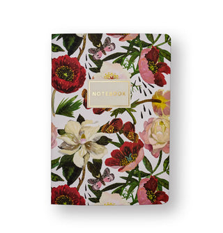 White notebook cover features colorful illustrations of peonies and moths and the word "Notebook" printed in gold foil in a central white title block