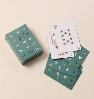 Spreads and box of Dogs! Playing Cards show card fronts and backs, all featuring dog-themed elements and illustrations
