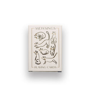 White box of Mewsings Playing Cards features gold and black abstract illustrations of cats posing in various ways
