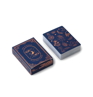 Dark blue stack and box of She Is Magic Playing cards featuring mysterious copper foil artwork and symbology