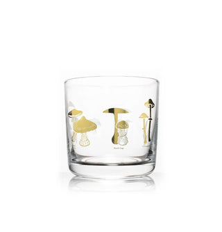 Clear glass cocktail tumbler with labeled gold foil poisonous mushroom illustrations