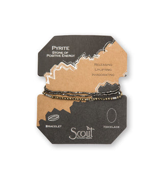 Pyrite and hematite beaded bracelet/necklace wrapped around product card with gold foil design details