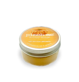 Yellow-gold 10-ounce pot of Pumpkin scent Pinch Me Therapy Dough with white lettering and a pumpkin illustration on the lid