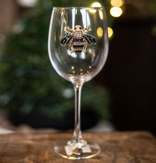 Clear wine glass featuring a jewel-encrusted bee decal