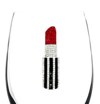 The clear bowl of a whine glass features a rhinestone-encrusted emblem of a striped tube of red lipstick