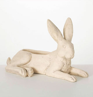 Planter pot designed to resemble a resting hare with opening in the top along its back