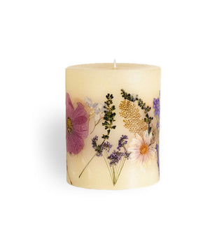 Whitish single-wick pillar candle with inlaid flowers and leaves